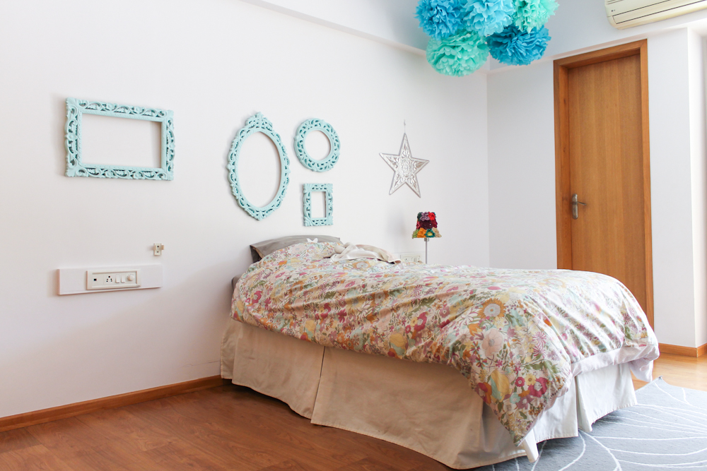 girls room with blue pompoms & frames-10