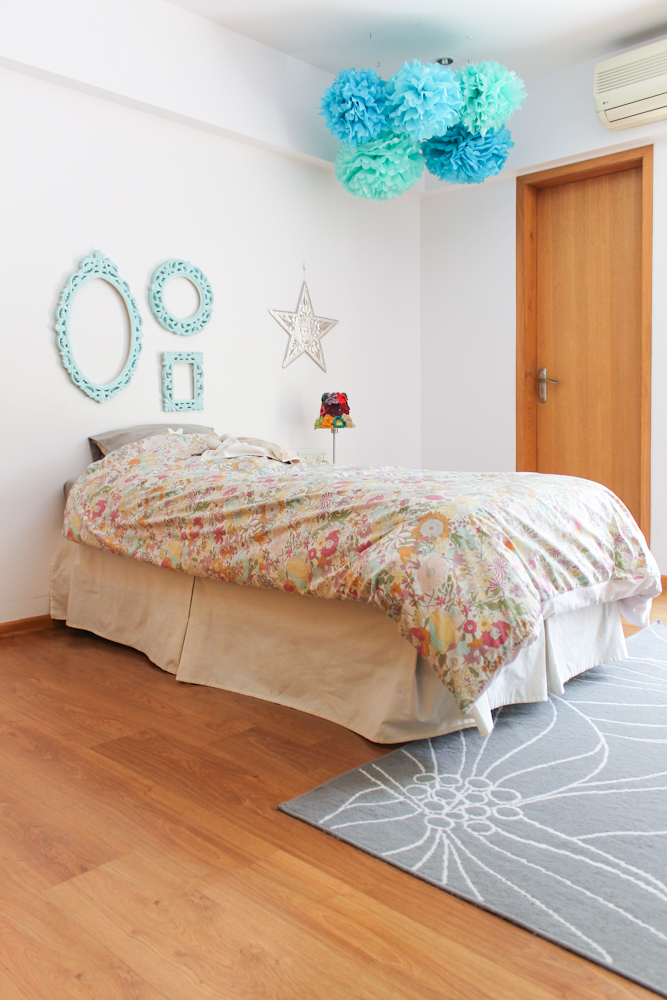 girls room with blue pompoms & frames-11