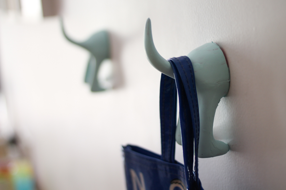 girls room with blue pompoms & frames